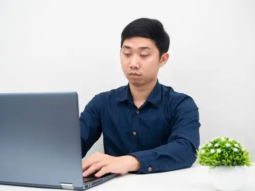Businessman using laptop on the table for working online 