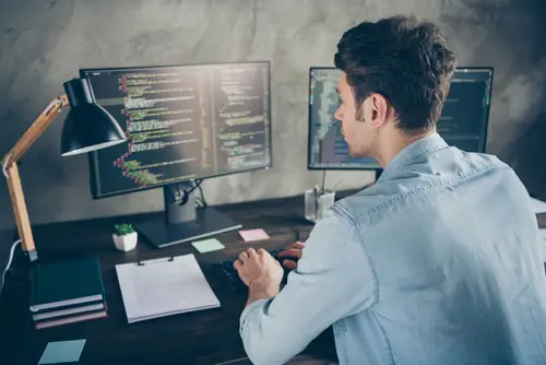 Rear back behind view portrait guy typing css analyzing cyberspace security