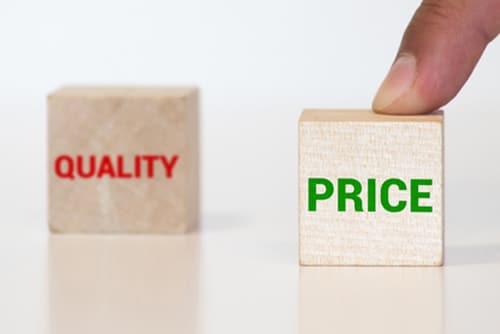 Price Versus Quality. The Cube With the Word Quality Is Selected
